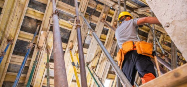 Worker doing structural site inspection: what sets quality custom home builders apart in Billings.